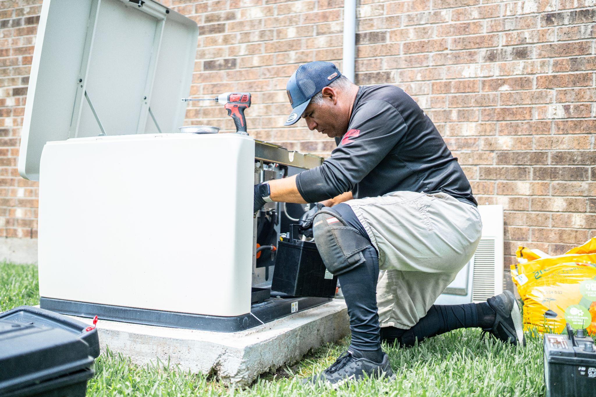 genpro-employee-installing-generator